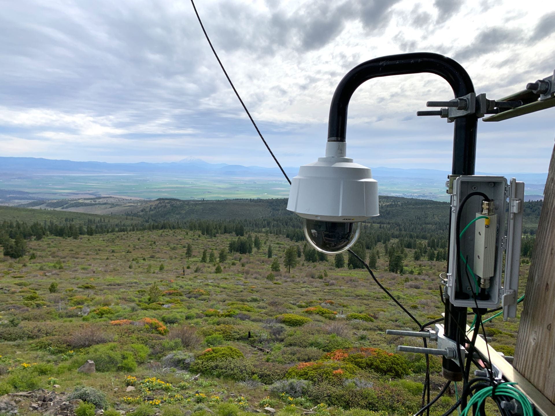 Wildfire detection camera on fire lookout tower has views of valley